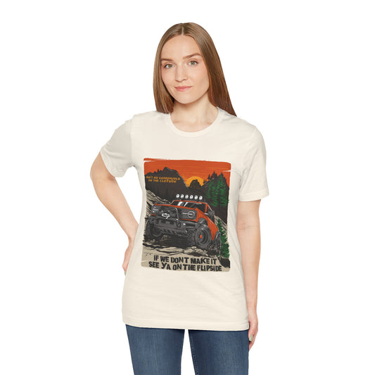 Woman wearing a t-shirt with a graphic design of a truck and text on a white background