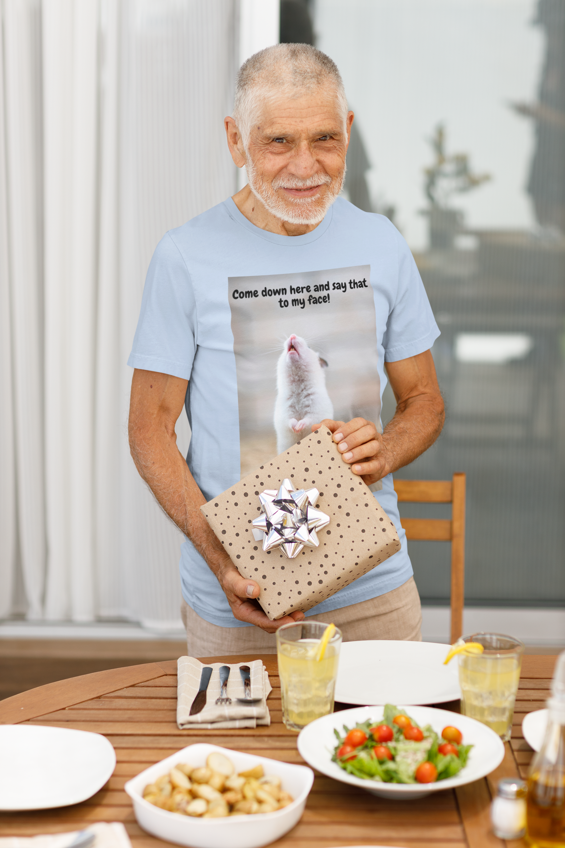 Man holding a gift box at the dining table.