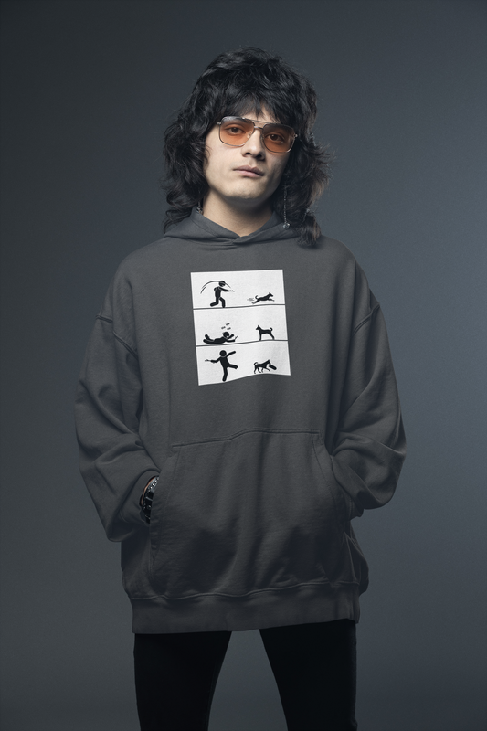 A person wearing a gray hooded sweatshirt with a graphic design in the center, standing against a dark background.