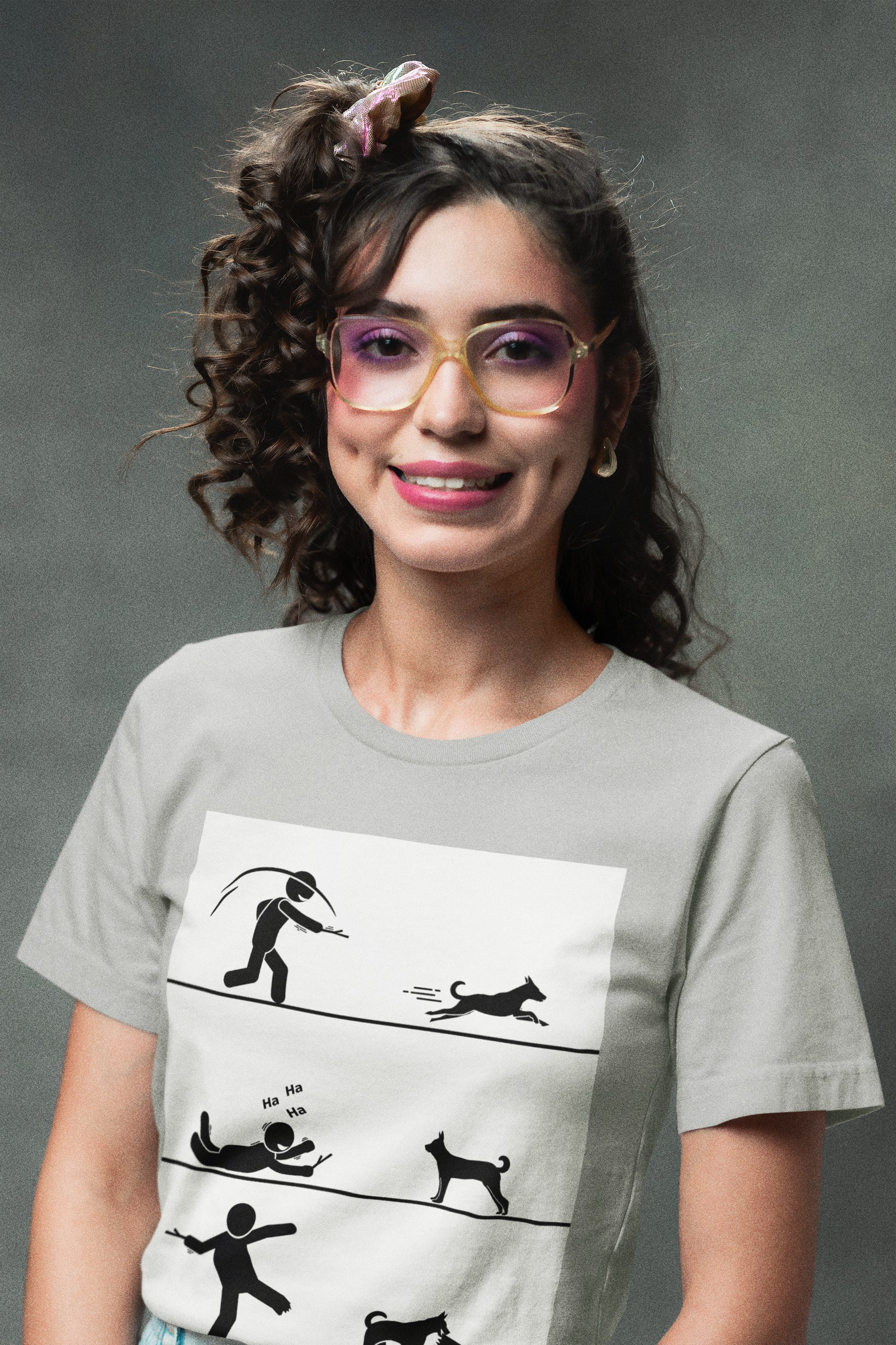 Woman wearing a t-shirt with a graphic design on a gray background