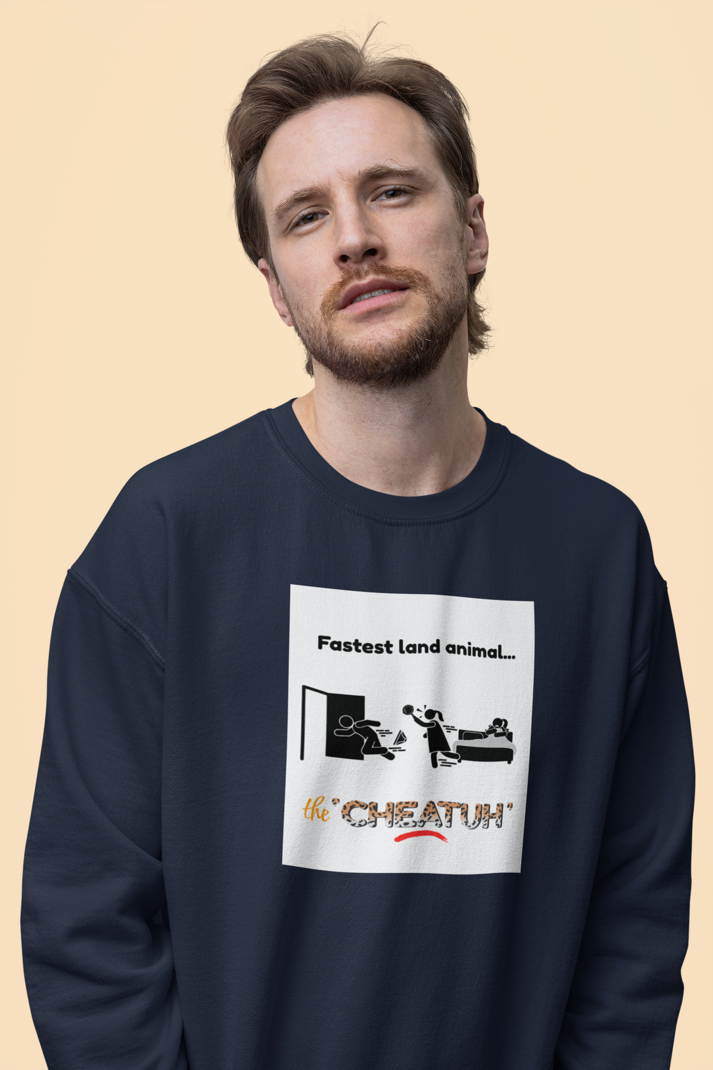 A person wearing a navy blue crewneck sweatshirt with a graphic print in the center that depicts a cheetah and the text 'Fastest land animal.