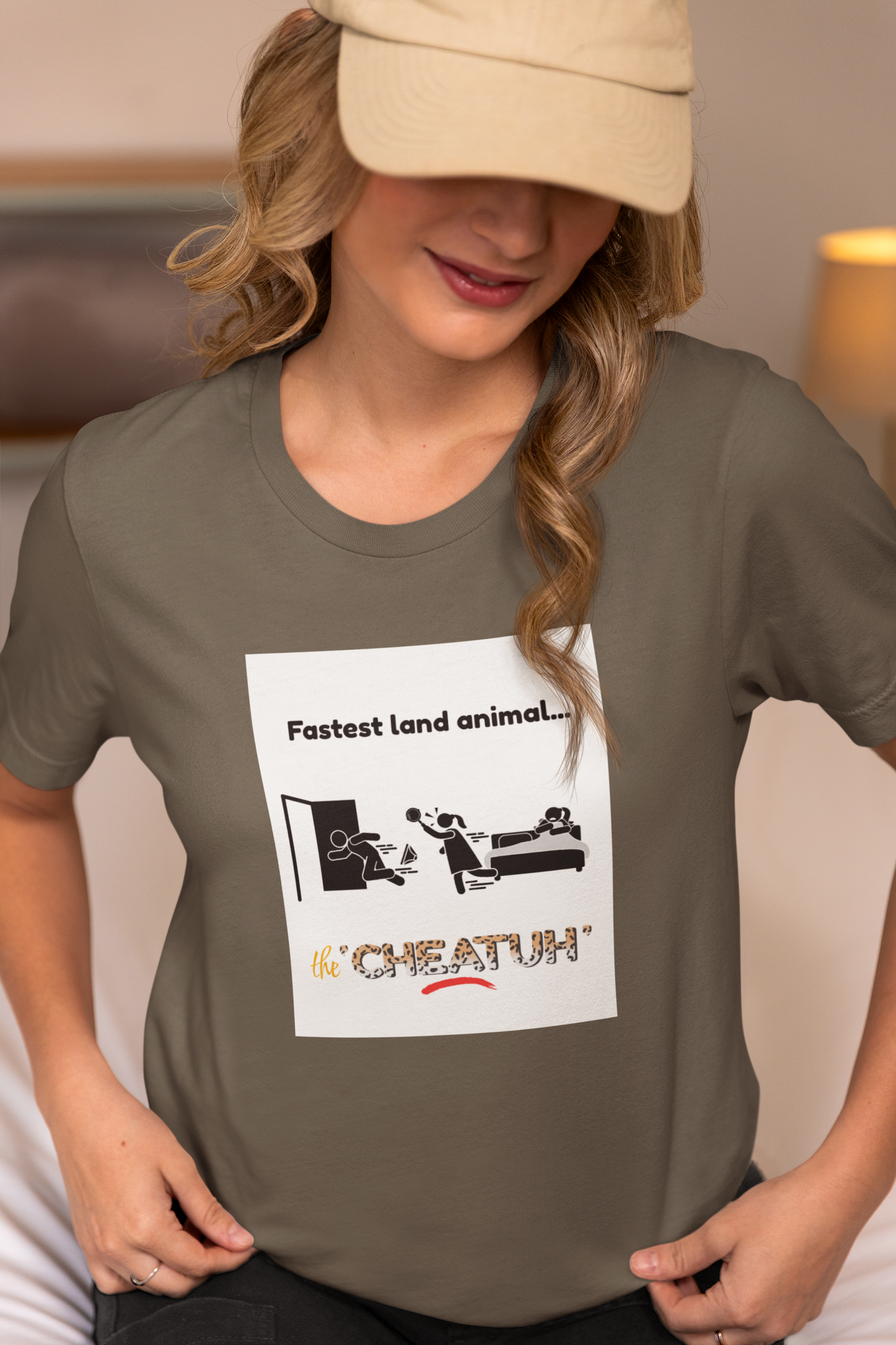 A person wearing an army t-shirt with a graphic print of a cheetah and the text 'Fastest land animal... The 'Cheatuh'.'